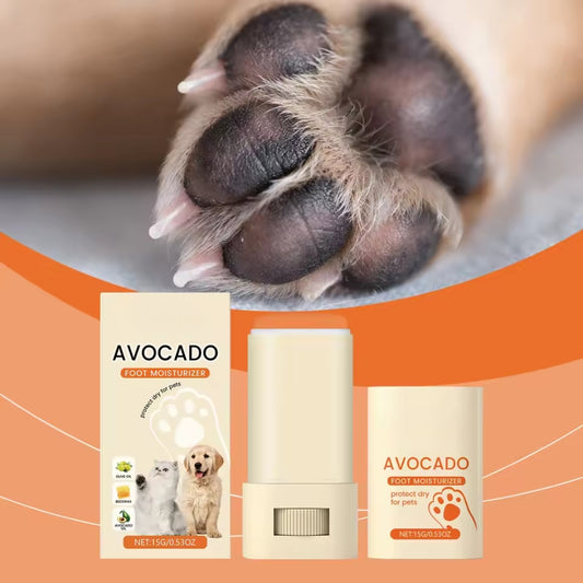 Applying moisturizing balm to dogβs dry paw
